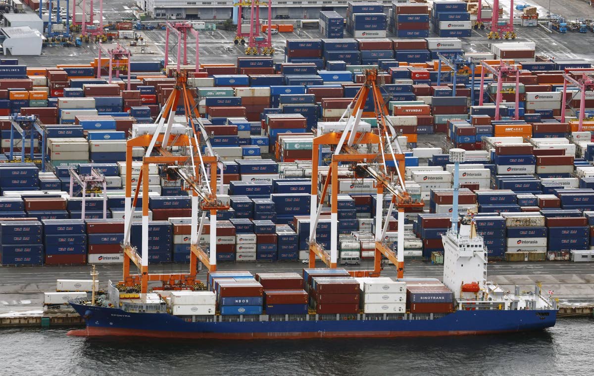Containers are stacked at a port in Yokohama, near Tokyo on August 1, 2025. (Takuto Kaneko/Kyodo News via AP)