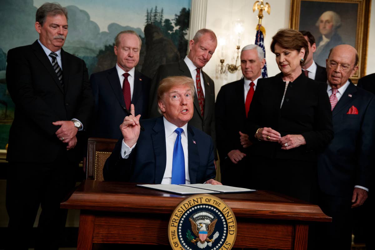 President Donald Trump speaks before he signs a presidential memorandum imposing tariffs and investment restrictions on China in the Diplomatic Reception Room of the White House, March 22, 2018, in Washington. (AP Photo/Evan Vucci, File)