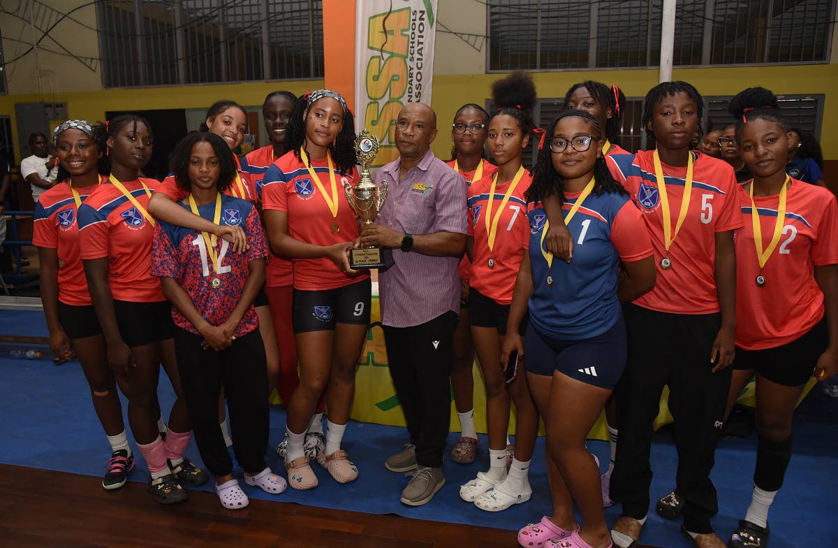 Members of Knox College display the trophy they won after defeating Immaculate Conception High School in the ISSA All-Island Schoolgirl Volleyball final at GC Foster College yesterday.
