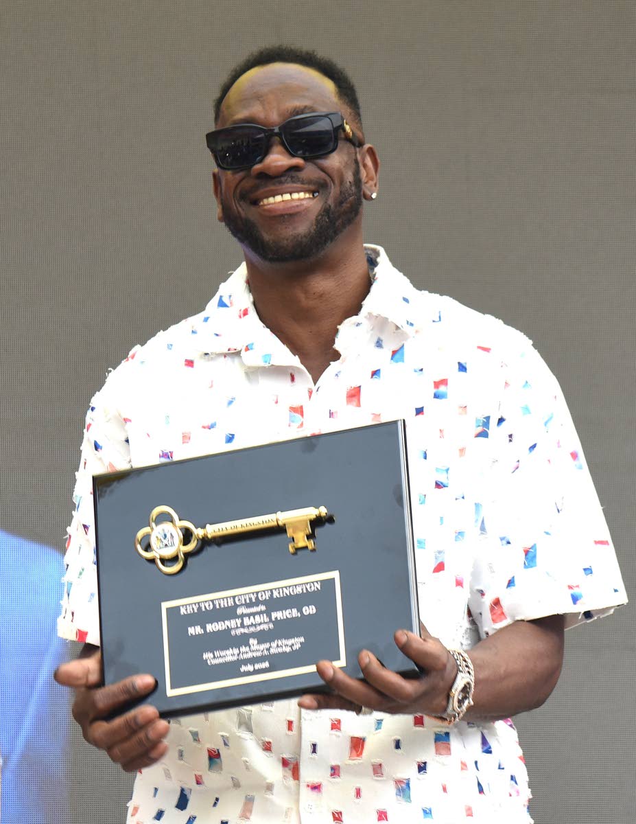 Rodney Price shows off the Key to the City of Kingston after it was presented to him by the Mayor of Kingston Andrew Swaby. 