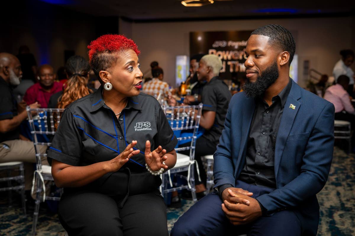 Head of the JPS Foundation Sophia Lewis (left) in conversation with Paul Thomas Watson, one of the Foundation’s six Power Up East-West Power Grant recipients at a recent awards ceremony at The Jamaica Pegasus hotel in New Kingston. Watson was awarded a s