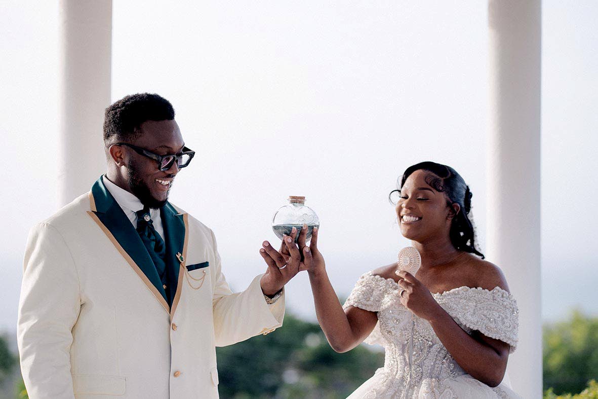 This husband-and-wife duo engaged in a traditional sand ceremony to celebrate their union. 