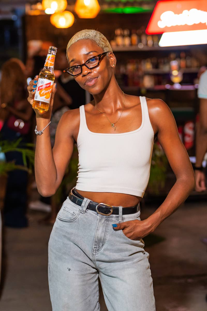 Jamaica Football Federation Marketing Manager Avery Campbell picks her flavour for the night: mango.