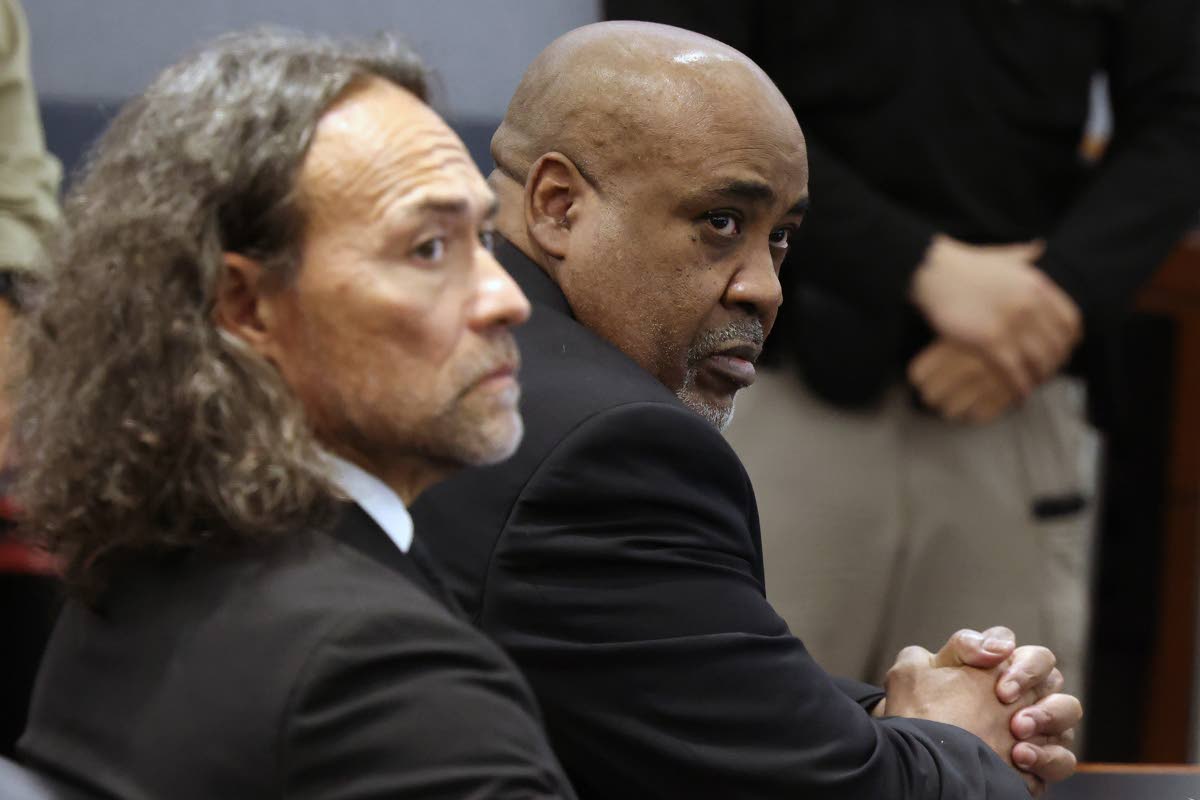Duane Davis (right) and his attorney Michael Sanft sit in a courtroom after a jury found Davis guilty of first-degree murder in his trial related to the 1996 killing of rapper Tupac Shakur, at Clark County District Court Regional Justice Center, Monday, Au