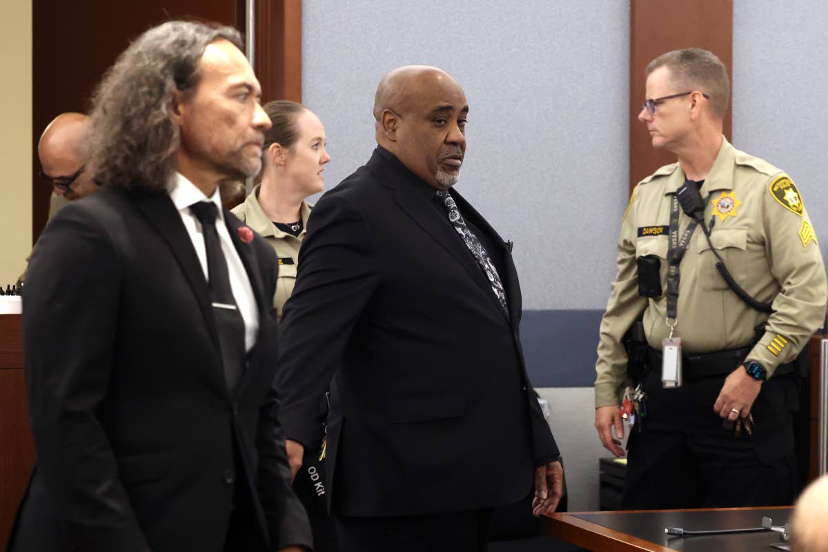 
Duane Davis (centre) and his attorney Michael Sanft are led back to a courtroom to hear his sentencing date after a jury found Davis guilty of first-degree murder in his trial related to the 1996 killing of rapper Tupac Shakur.