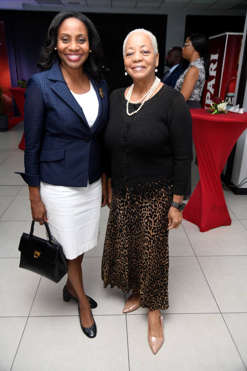 Catching up at the reception were Ambassador Shorna-Kay Richards, under-secretary for multilateral affairs at the Ministry of Foreign Affairs and Foreign Trade (left), and Ambassador Sandra Grant-Griffiths, chief of state protocol at the Office of the Prim