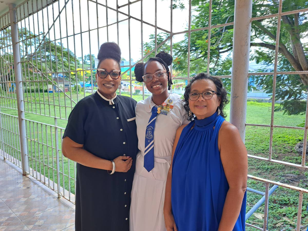 From left: Mount Alvernia High School Principal Kayon Whyne, grade 11 student Summer-Rose Bailey, and Dawn Chin-Jones, president of the school’s Central Florida International Alumni Association, celebrating after the dedication service.
