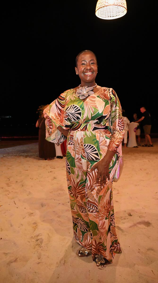 Marsha-Ann Donaldson, corporate director of weddings and romance at Sandals Resorts International, makes her rounds in a striking multi-coloured number.