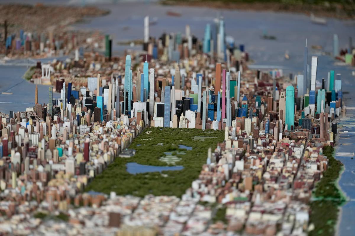 Central Park and the tall buildings of midtown Manhattan are seen on a large model of the New York City, made by Joe Macken, at the Museum of the City of New York in New York.