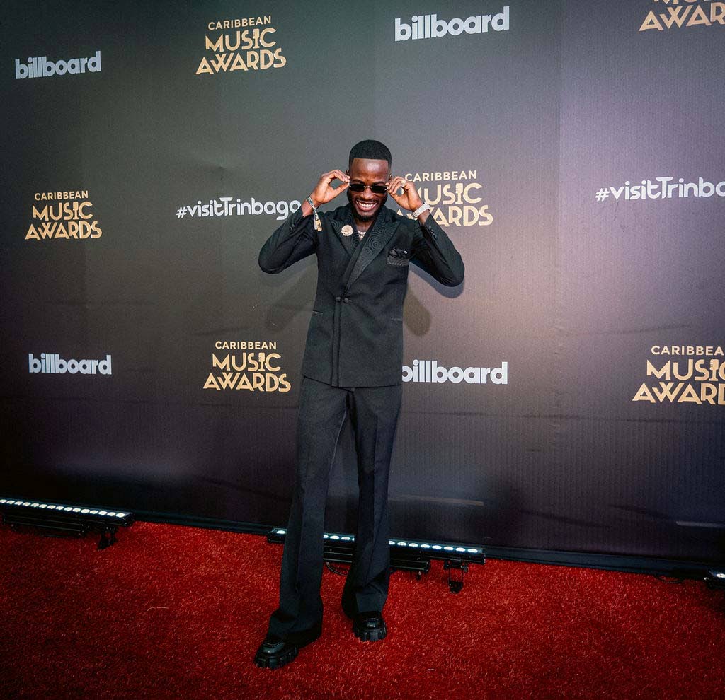 V’ghn, winner of Jab Artiste of the Year and Jab Song of the Year for his collaboration with Terra D Governor, is polished in a classic tailored double-breasted suit.