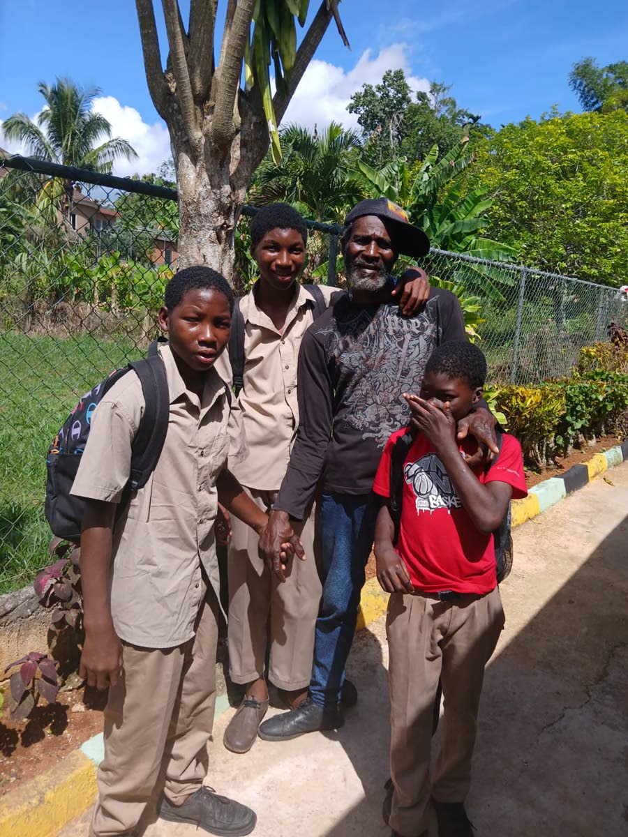 Delroy Britton and his sons. 