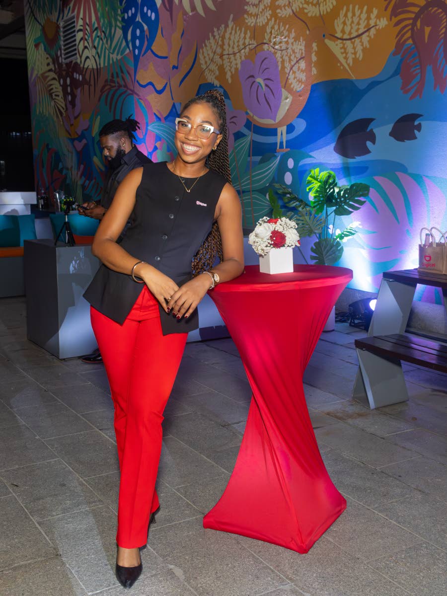 Brithney Clarke, Digicel Jamaica marketing business lead and public relations manager, embraces the brand’s signature red, matching her trousers with a black vest.