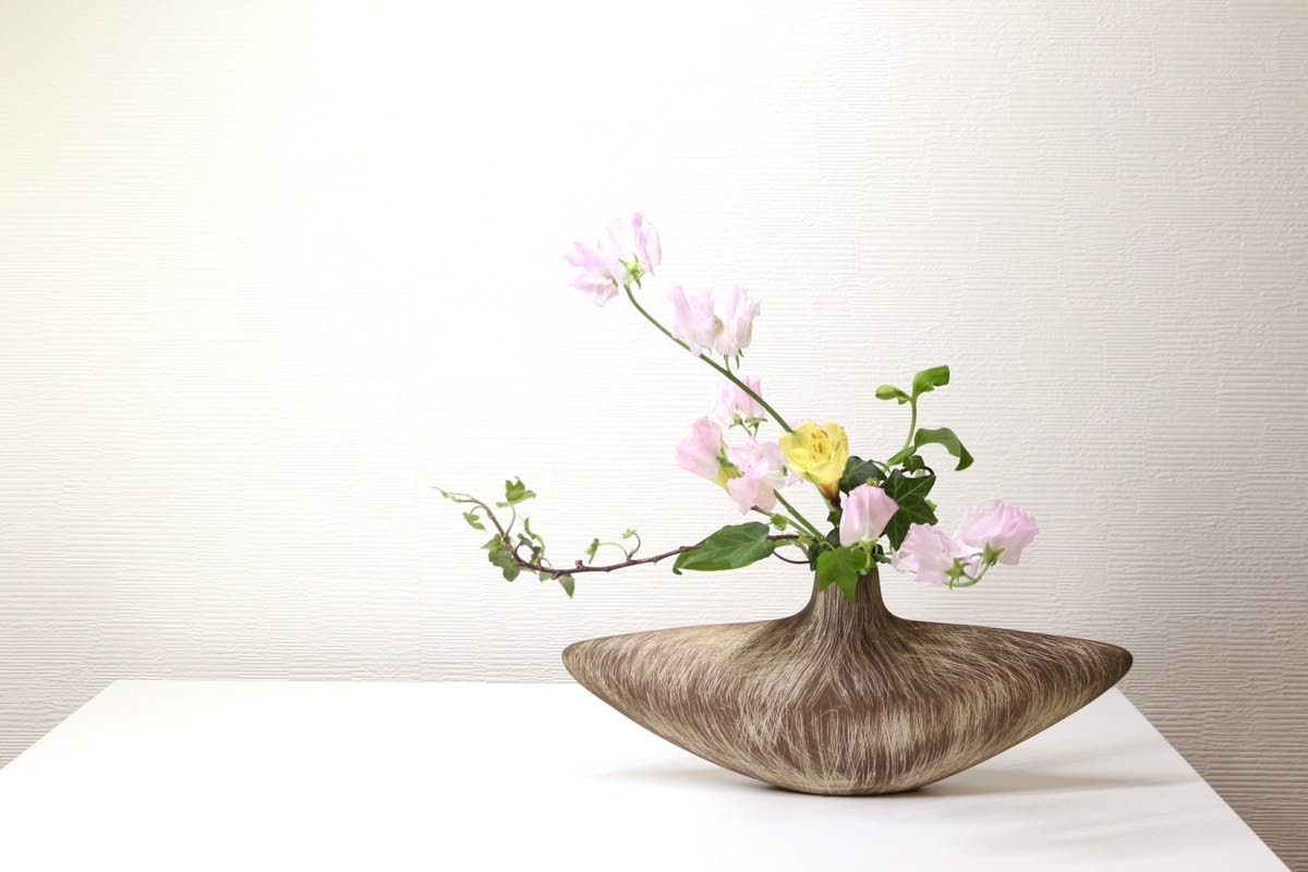 This photo, released by Hiroyuki Okada, shows a free-style Ikenobo ikebana arrangement. 