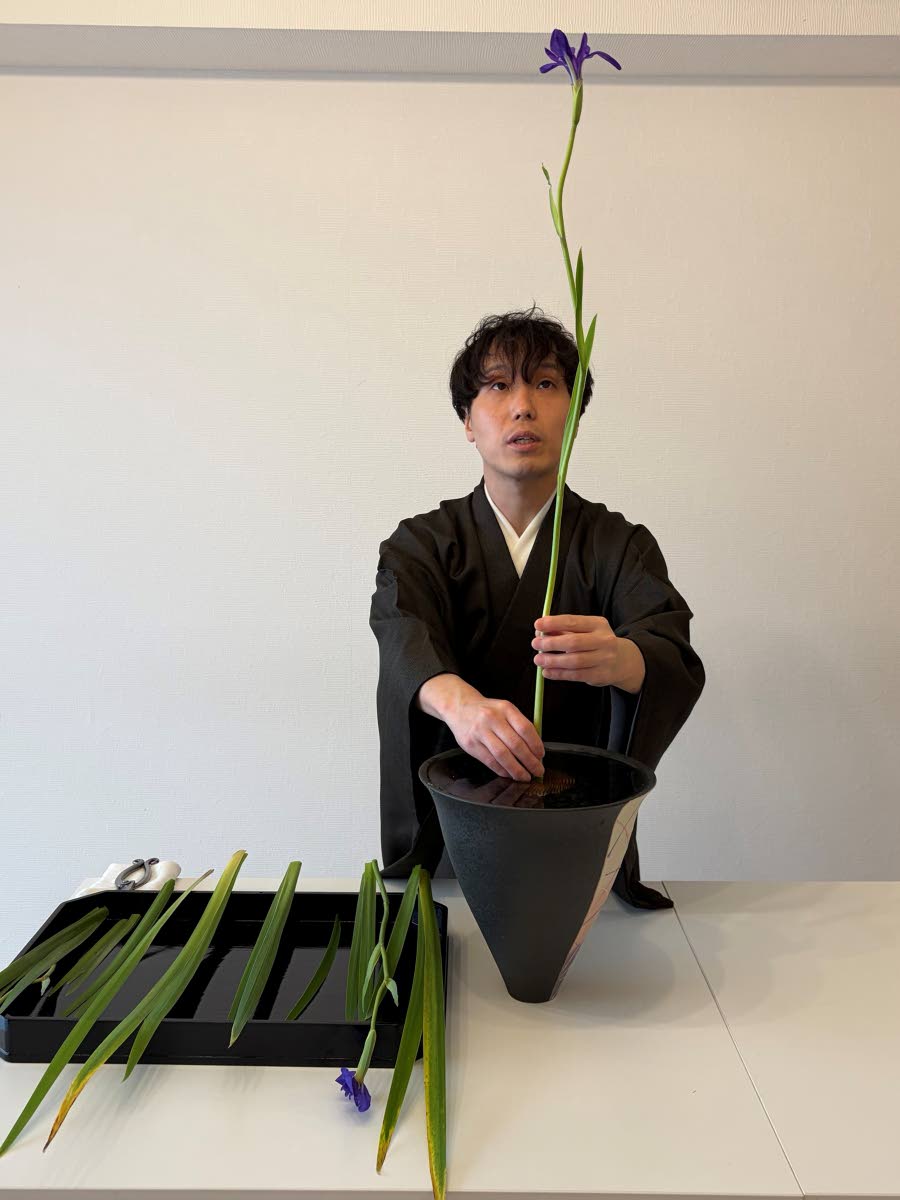 Ikenobo ikebana instructor Hiroyuki Okada demonstrates a basic flower arrangement style called ‘Shoka Shofutai’ at a studio in Tokyo. 