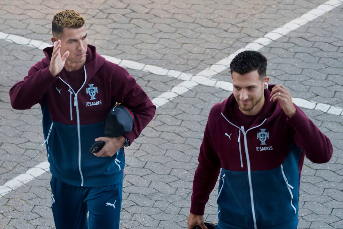 Portugal’s Cristiano Ronaldo (left) and Diogo Dalot arrive for training in Copenhagen, Denmark on Wednesday ahead of their Nations League  match against Denmark. 