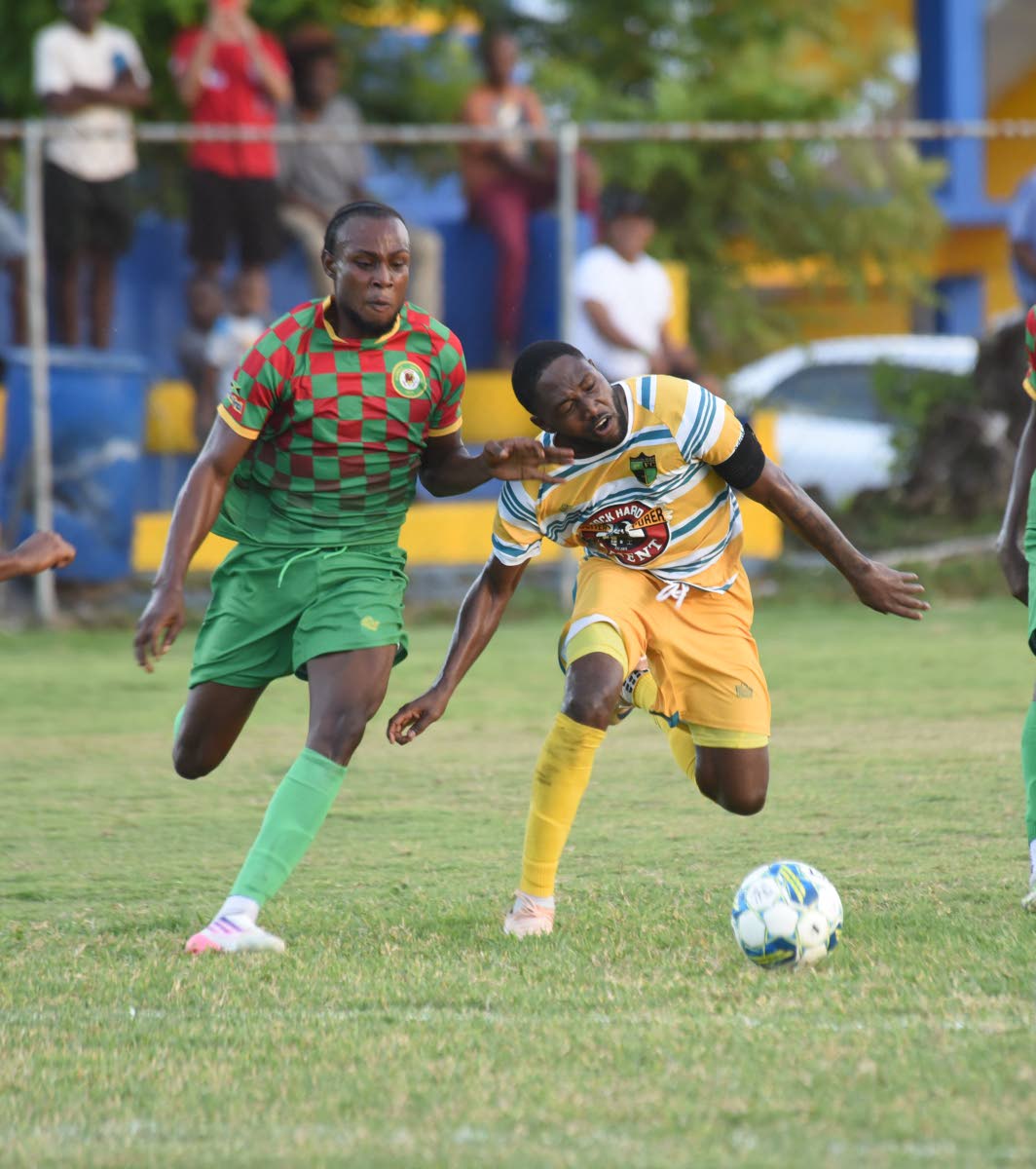 Humble Lion’s Nevar Brooks (left) and  Jhanni Flemmings of Treasure Beach battle for the ball during their Jamaica Premier League match at St Elizabeth Technical High yesterday. The game ended 1-1.