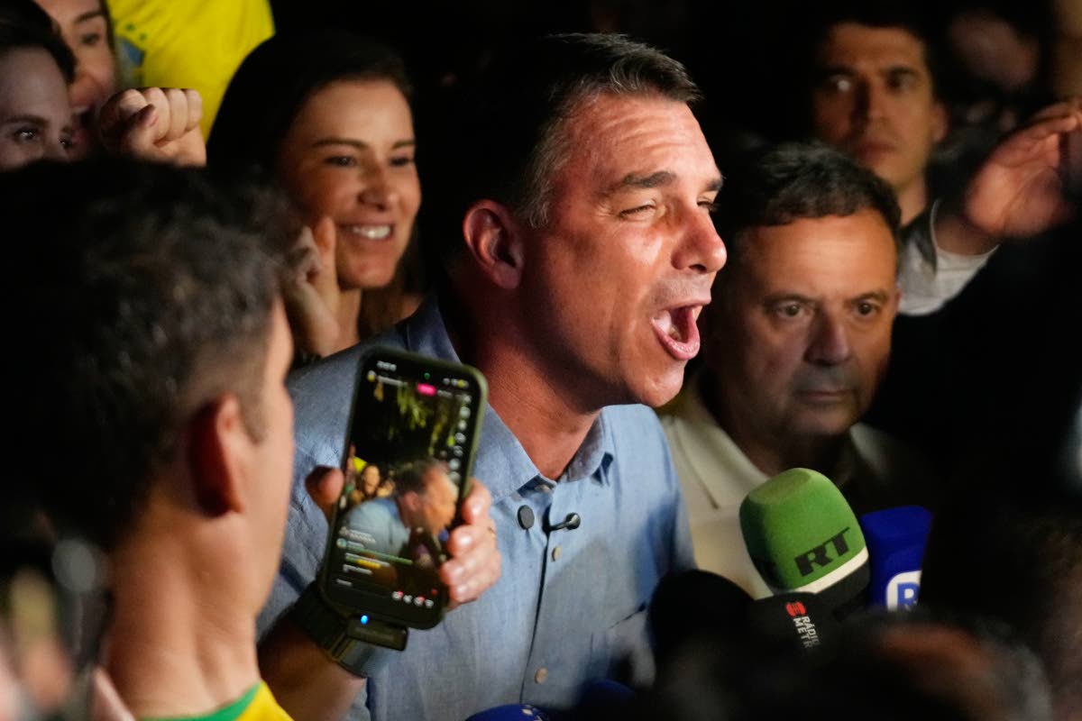 Opposition presidential candidate Senator Flavio Bolsonaro speaks after advancing to a runoff election following the first round of the presidential election in Brasilia, Brazil, Sunday.