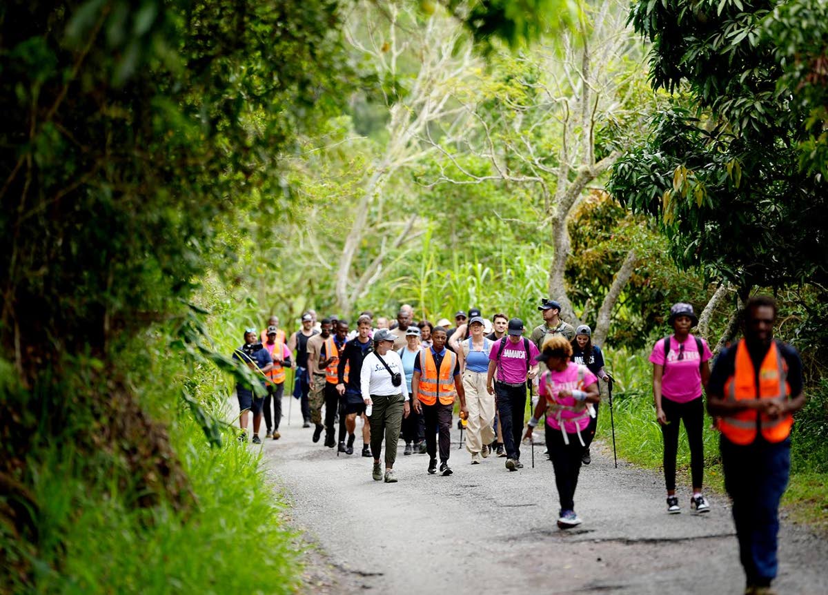 Members of the Jamaica Defence Force and Trekkers Adventures lead participants in the Sandals Foundation Island Challenge on a military-style trek through the Blue Mountain range, starting at Newcastle in St Andrew.