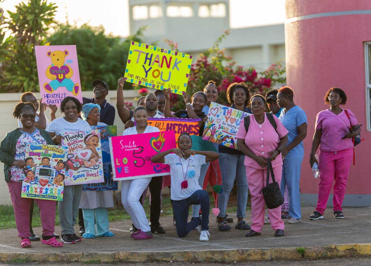 Doctors and nurses at Falmouth Public General Hospital show their support for local and international participants in the Sandals Foundation Island Challenge.