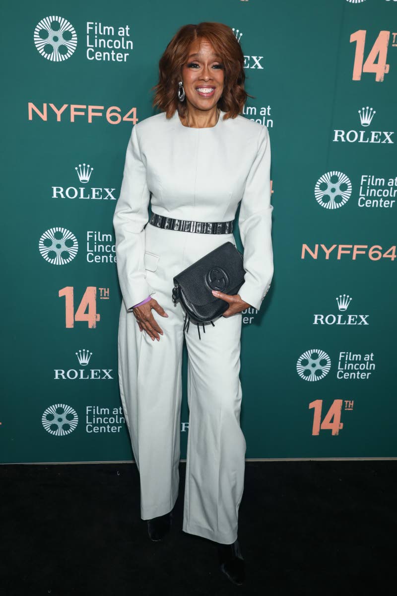 Gayle King dons a structured, off-the-shoulder jumpsuit, cinched with a black leather belt.