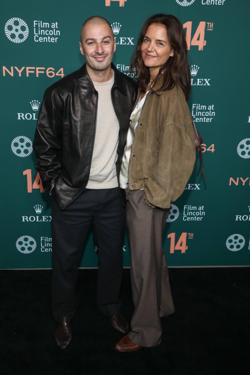 Jason Bard Yarmosky (left) and Katie Holmes attend the premiere of ‘14th’ during the 64th New York Film Festival at Alice Tully Hall in New York on Friday.