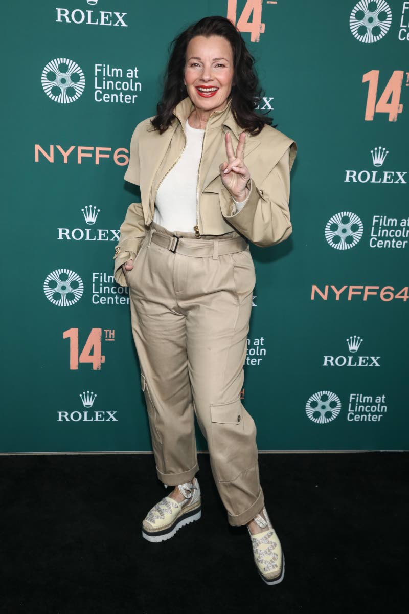 Fran Drescher pairs a khaki cropped bomber with high-waisted trousers for a casual look.