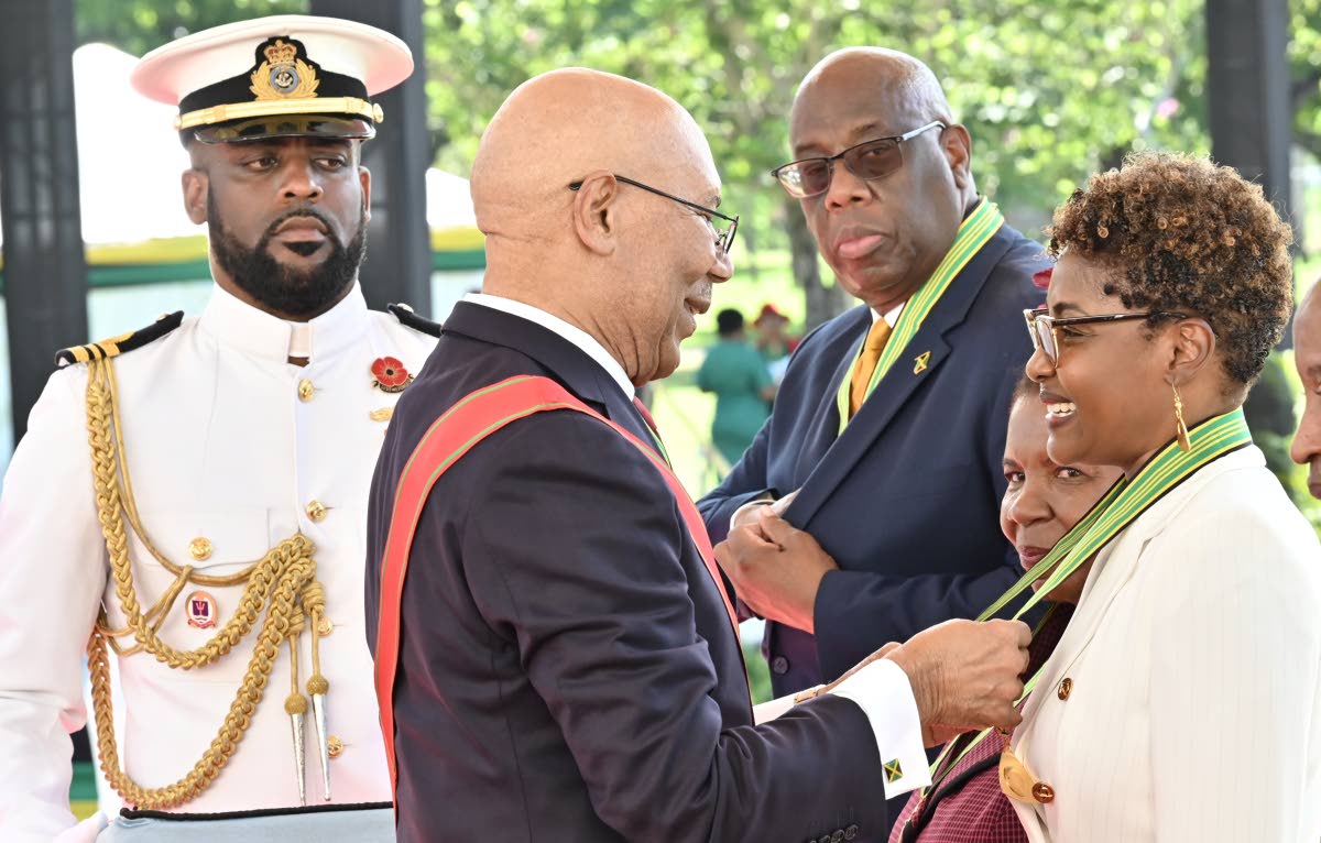 Pamela Monroe Ellis (right), Auditor General of Jamaica, receives the Order of Distinction in the Rank of Commander from Governor-General Sir Patrick Allen during the National Honours and Awards Ceremony 2026 at King’s House. At second left is fellow rec