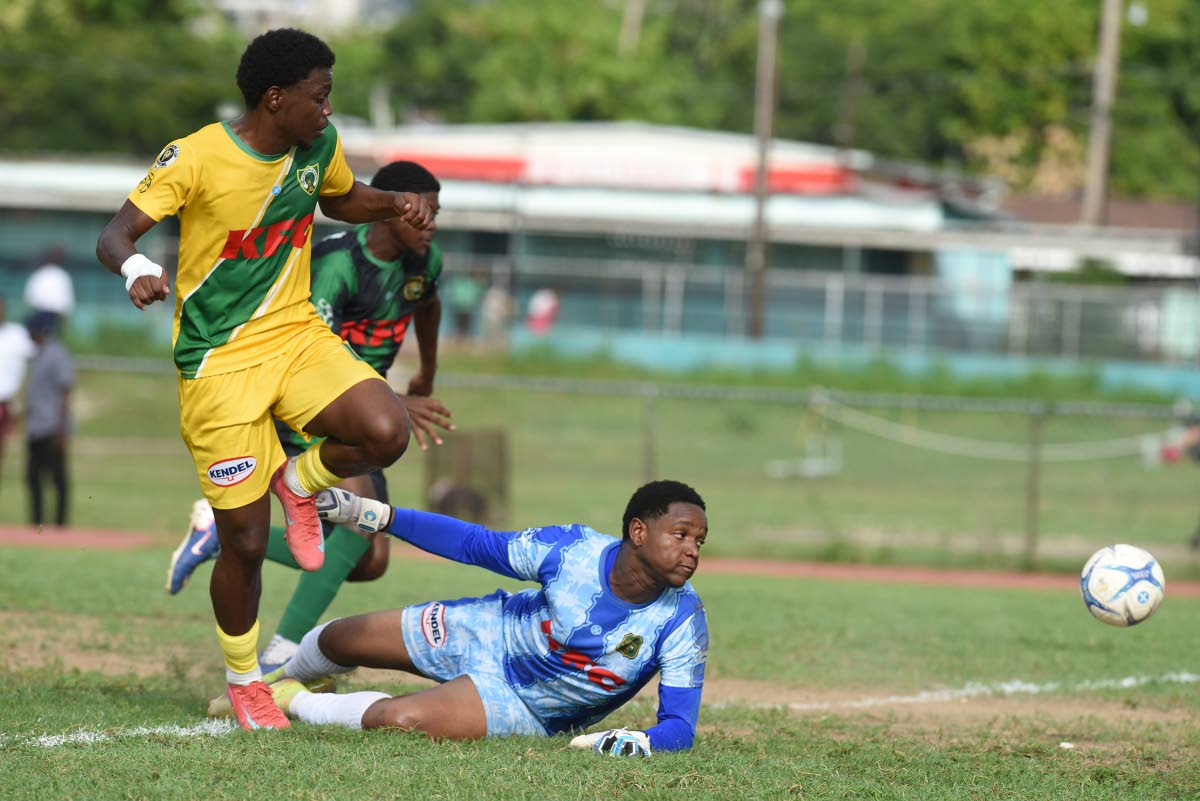 Excelsior High’s Habbie Mohammed (left) scores past Calabar High’s goalkeeper Jahiem Russell during a Manning Cup match at Calabar on October 13, 2026. 