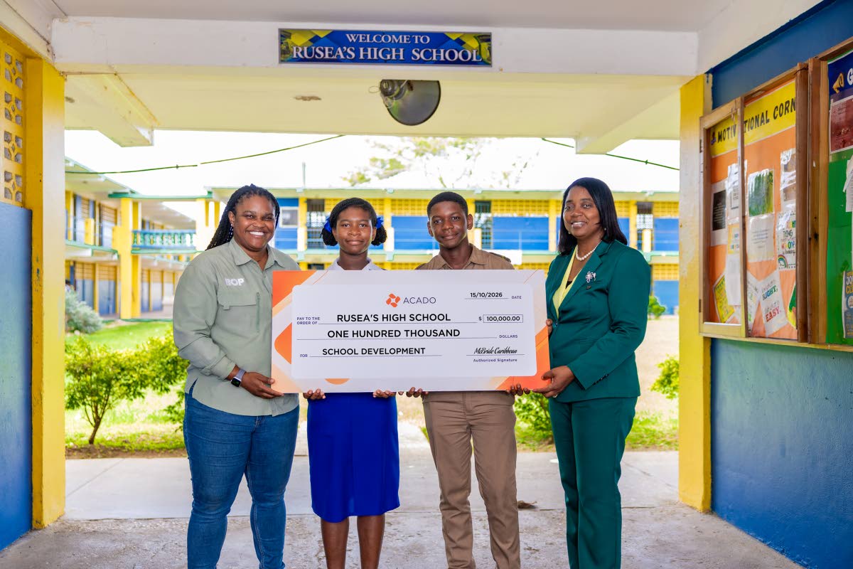 Students and Principal of Rusea’s High School receive a development fund donation from McBride Caribbean Limited’s Beep,Bop and Go brands, facilitated through ACADO Jamaica. Pictured from left are Kamaica Fagan, brand manager for Beep, Bop and Go; stud