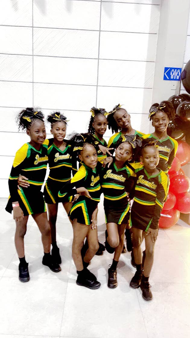 Members of the gold medal-winning Jamaican junior national cheerleading team from St Jude’s Primary School celebrate their historic victory. Front row, from left: Rickayla Brown, Arianna Temple, D’ziah Brown, Brianna Collins and Keziah Barton. Back row