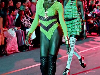 Actress Jodie Turner-Smith wears a custom Diotima bodysuit at the Vogue World 2025: Hollywood show on October 26 as model Abény Nhial follows behind her.