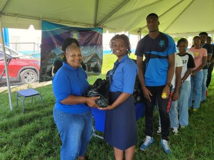 Far left, Jackie Josephs Haughton, board member of Manning’s Past Students Association York Chapter, presenting care packages to the students at Manning’s School 