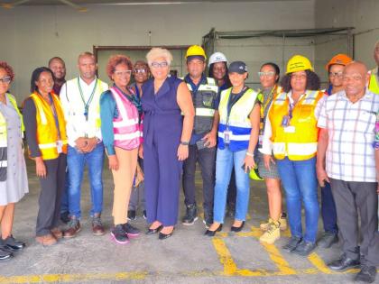 Kingston Wharves officials take commercial partners from the Customs Brokers and Freight Forwarders Association of Jamaica and the Jamaica Society of Customs Brokers on a tour of the company’s new Commercial Stripping Centre.