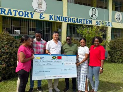 From left: Tommy Clemenson, parent; Patricia Robinson-Jones, vice-principal; Ryan Wright, senior teacher; Zipping Chen, president of the Fujian Association of Jamaica and representative of the Chinese community; Dr Anthony Taylor, principal; Sheri-Kay Morr