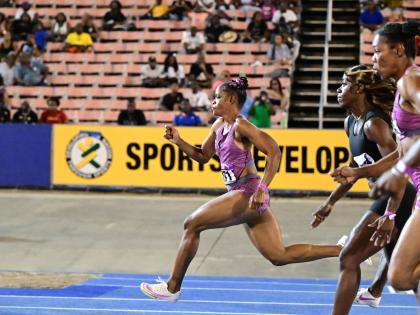 Tia Clayton (left) powers to victory in Section B of the women’s 60 metres at last year’s Gibson McCook Relays. Clayton won in  7.02 seconds.