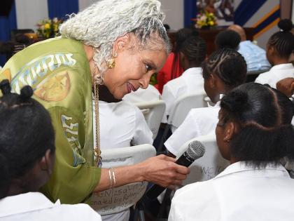 American actress Phylicia Rashad interacts with adolescent mothers during a conversation about motherhood, education and discipline at the Women’s Centre of Jamaica in St Andrew yesterday. 