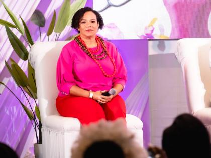 Robertson-Sylvester on stage at Plie’s Women of Vision Salon.