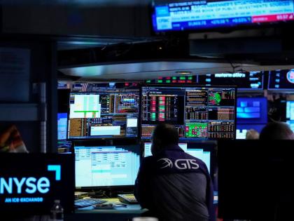 Specialist Dilip Patel works on the floor of the New York Stock Exchange, Thursday, July 30, 2026, in New York. 