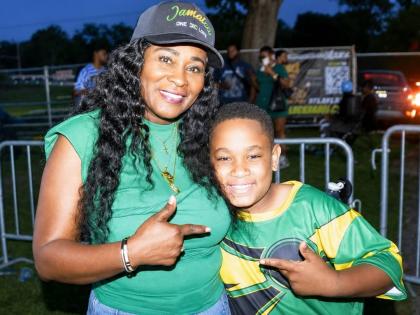 Lady G poses with 10-year-old singer RJ following their duet of ‘Thank You’, the 1995 gospel hit produced by Philip ‘Fatis’ Burrell, at the 10th annual Jamaica Day Celebration at Eastside Park in Paterson, New Jersey, on August 1.