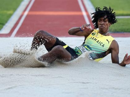 Jamaica's Michael Andre Edwards hits the sandpit during the triple final at the World Athletics Under-20 Championships at the Hayward Field in Eugene, Oregon yesterday.