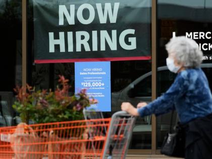 AP
A hiring sign for sales professionals is displayed at a store in Vernon Hills, Illinois, on Wednesday, April 15.  