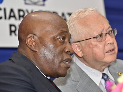 Delroy Chuck (right), minister of justice and constitutional affairs, chats with Justice Bryan Sykes, chief justice of Jamaica, during the Judiciary’s Strategic Management Retreat at the AC Hotel in Kingston on Monday.