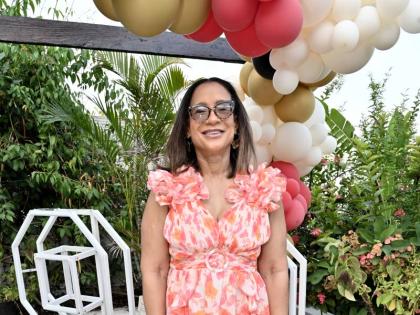 Grateful to celebrate with her mother for another birthday, Allison Rattray, attorney-at-law, rocks a vibrant maxi.