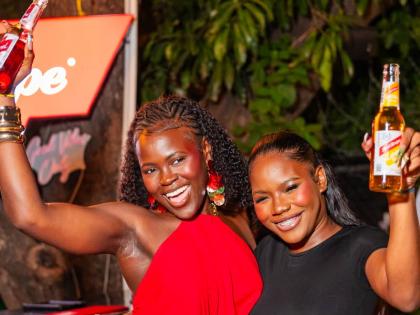 Content creators Kymara Robinson (left) and Harri-Anne Brissett raise a toast to a night of good vibes.
