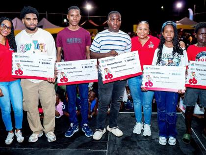 From left: Danielle Insang (left), brand marketing lead at CB Foods, with scholarship recipients Akeem Brown, Wayne Smith, Shamar Morrison, Shani Williams, Tyquon McDougall and Samantha Fisher (third right), assistant brand manager at CB Foods.
