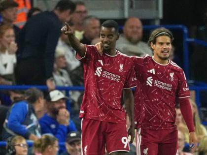 Liverpool’s Alexander Isak celebrates with Milos Kerkez (right) after scoring during the English Premier League match between Ipswich Town and Liverpool in Ipswich, England yesterday.  