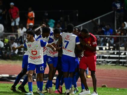 Hydel High’s Ronaldo Barrett (obscured) celebrates a goal with teammates during a Manning Cup Game against Jamaica College at the Ashenheim Stadium in St Andrew, Jamaica on Saturday, November 4, 2023. 