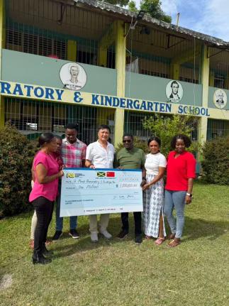 From left: Tommy Clemenson, parent; Patricia Robinson-Jones, vice-principal; Ryan Wright, senior teacher; Zipping Chen, president of the Fujian Association of Jamaica and representative of the Chinese community; Dr Anthony Taylor, principal; Sheri-Kay Morr