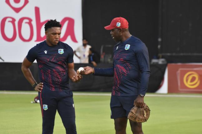 West Indies fast bowling consultant Ottis Gibson (right) gives instruction to fast bowler Jediah Blades during a series against Nepal in Sharjah in September 2025.