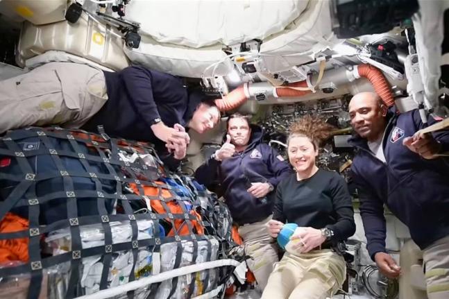 This image taken from video provided by NASA shows the Artemis II crew (from left) Canadian astronaut and mission specialist Jeremy Hansen, Commander Reid Wiseman, mission specialist Christina Koch and pilot Victor Glover, as they speak with NASA Mission C